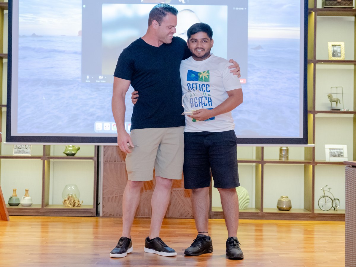 Rutvik Tolbande receiving his award from Time Doctor CRO Duane Dufault in Bali